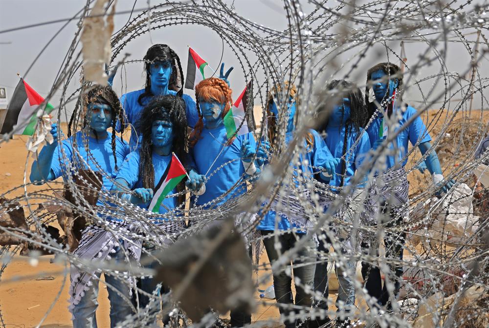 Palestinians dressed as Avatar characters protest near Gaza-Israel border
