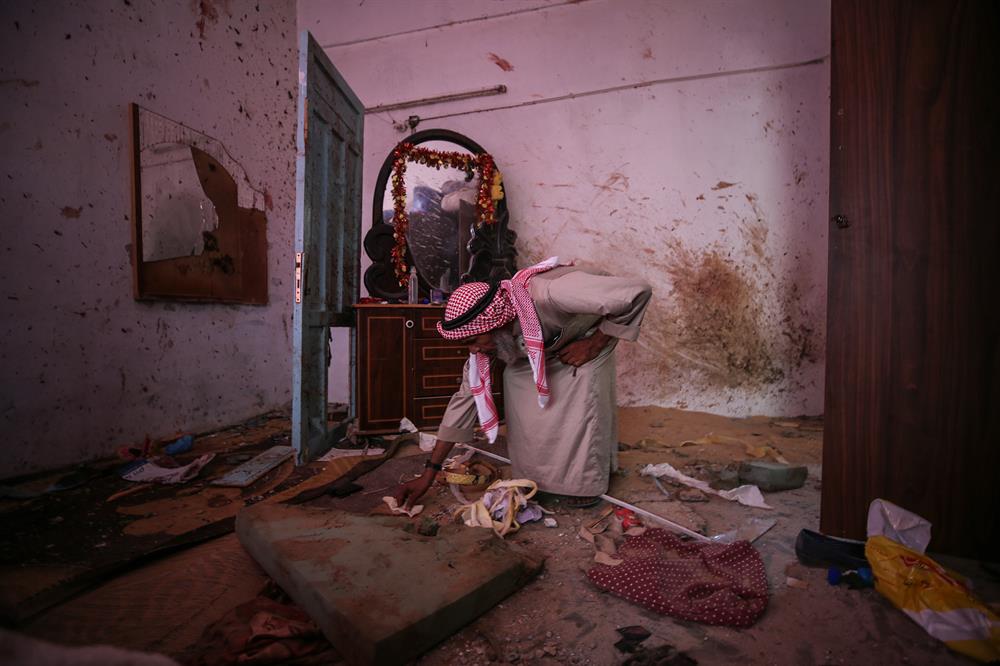 Palestinians insect the damage after warplanes belonging to Israeli army carried out an airstrike over residential areas in Deir Al-Balah, Gaza.