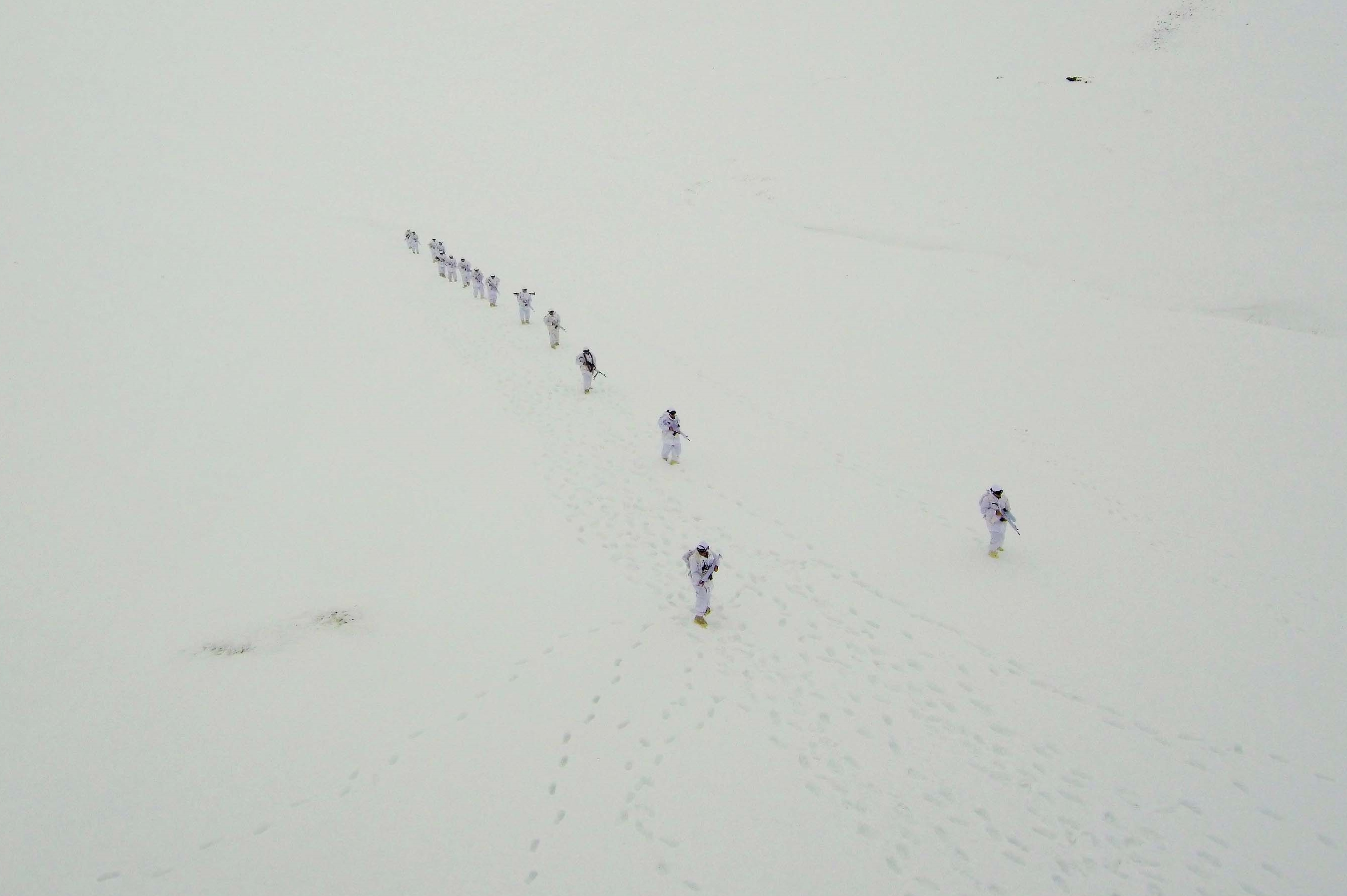 A drone photo shows an eerial view of Turkish Gendarmerie Special Operation and Commando Unit singing commando anthem after conducting search operation against PKK terrorist organization, in Mus, Turkey on December 03, 2018.  