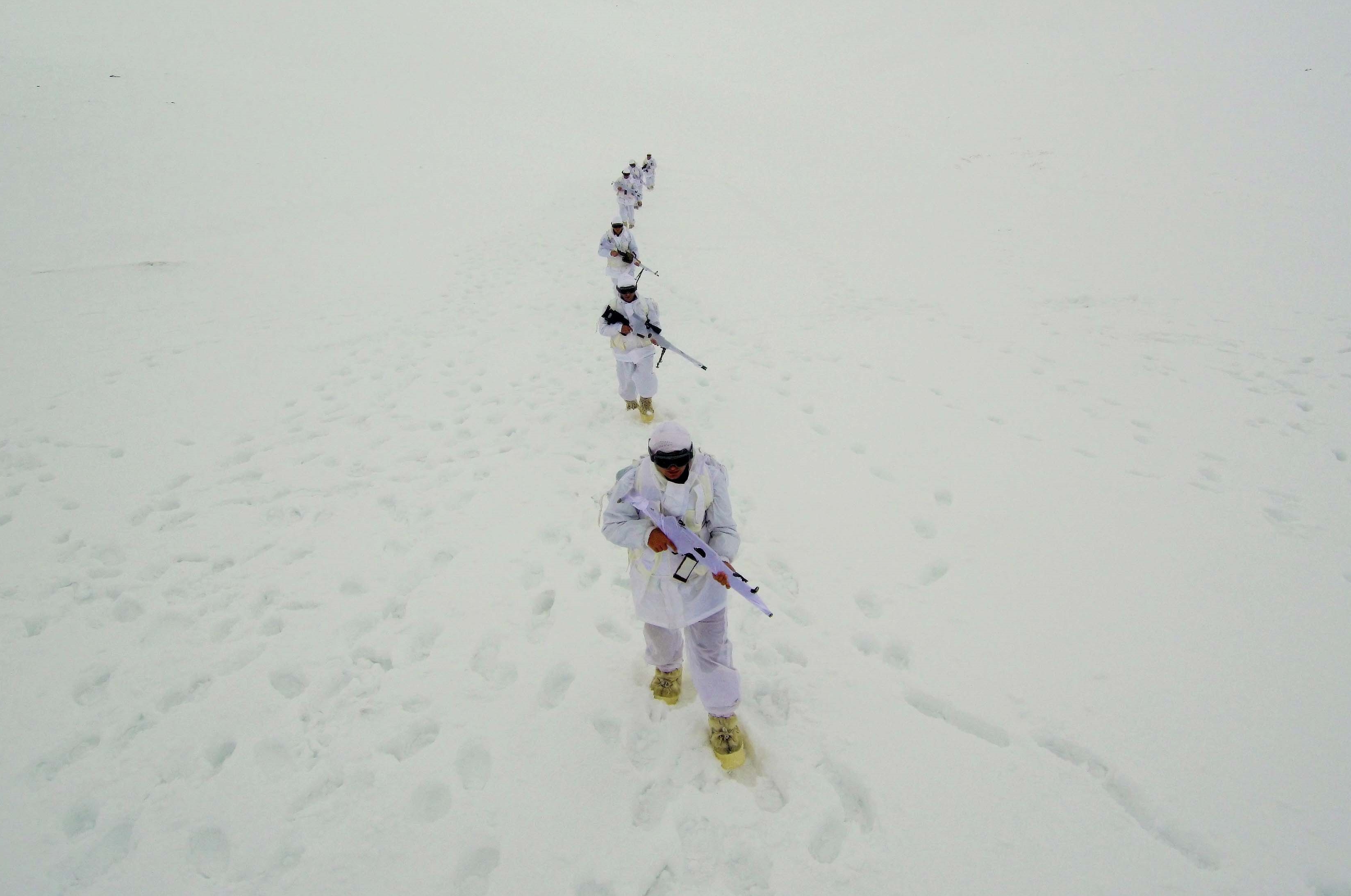 A drone photo shows an eerial view of Turkish Gendarmerie Special Operation and Commando Unit singing commando anthem after conducting search operation against PKK terrorist organization, in Mus, Turkey on December 03, 2018.  