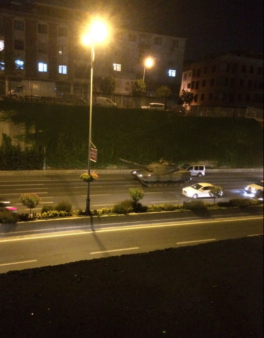 2	Security forces and civilians pulled an earth-mover horizontally to block the tanks on Vatan Avenue from entering the Istanbul Police Headquarters.